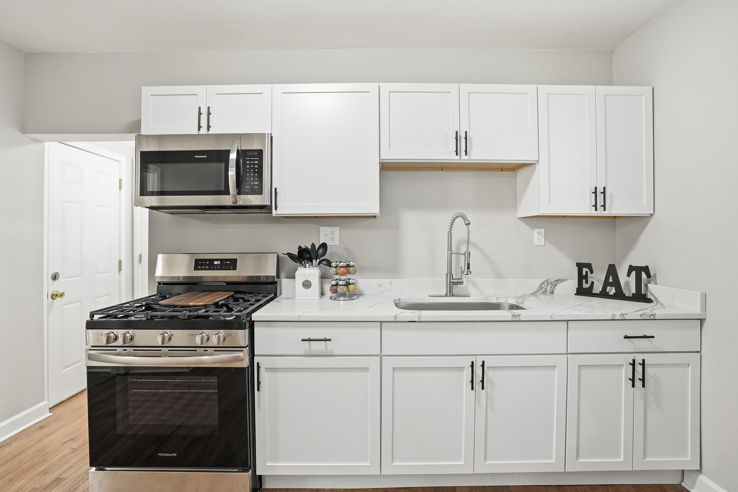 2406 Birch Avenue Whiting, IN 46394 - Photo 5 of 16 a kitchen with stainless steel appliances a sink stove and cabinets