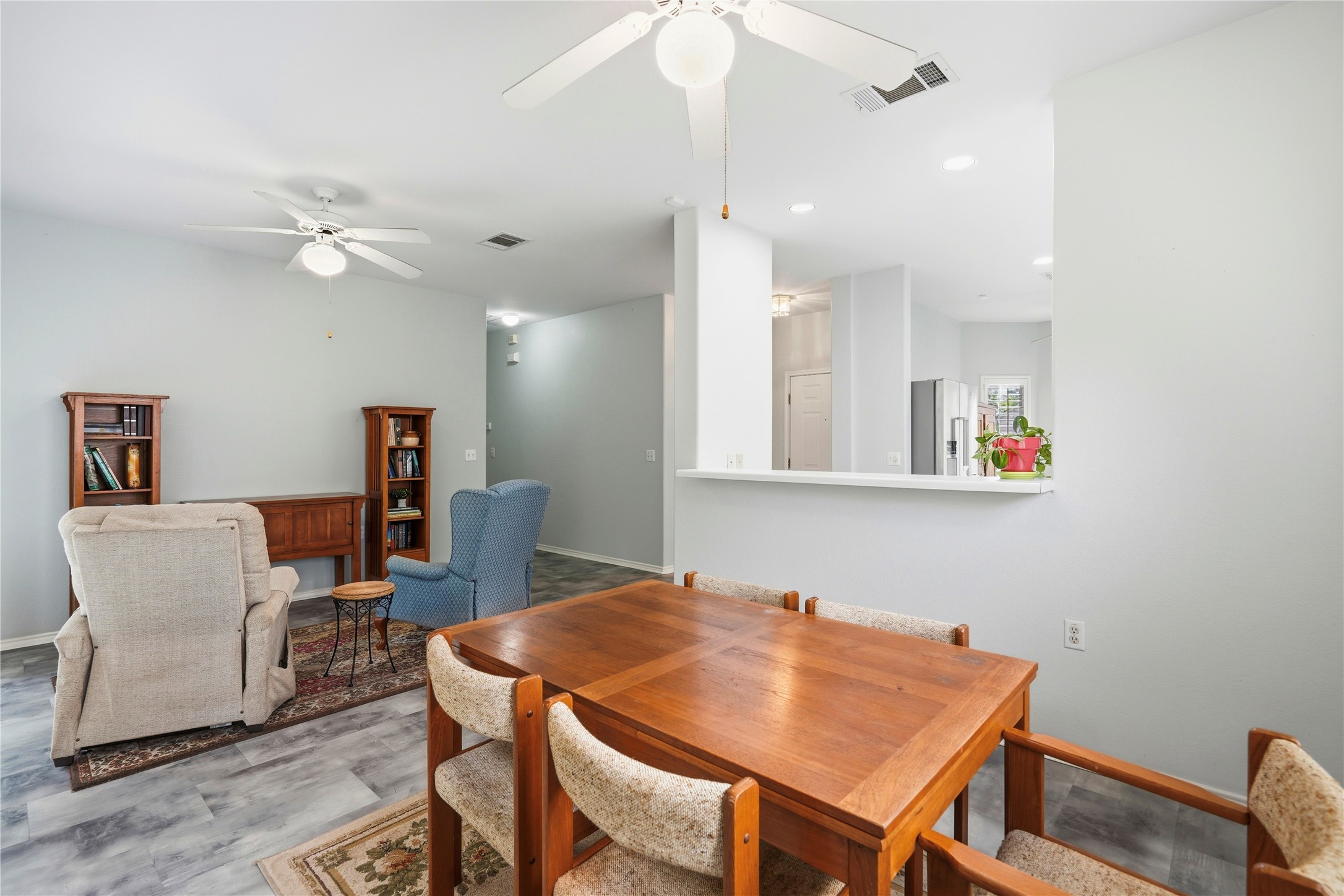 117 Whitewing Way Georgetown, TX 78633 - Photo 26 of 27 An open floorplan seamlessly connects the dining area with a comfortable living space, offering clear sightlines.