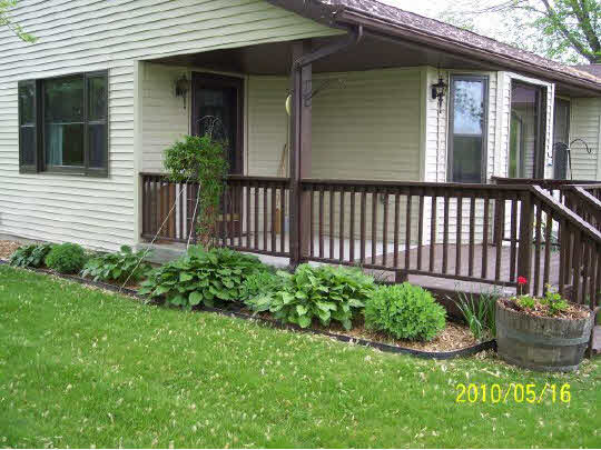 2071 Hillsdown Road Lake Summerset, IL 61019 - Photo 11 of 11 a view of a house with brick walls and flower garden