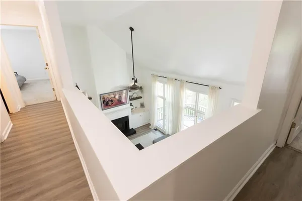 a view of a living room with furniture and a chandelier