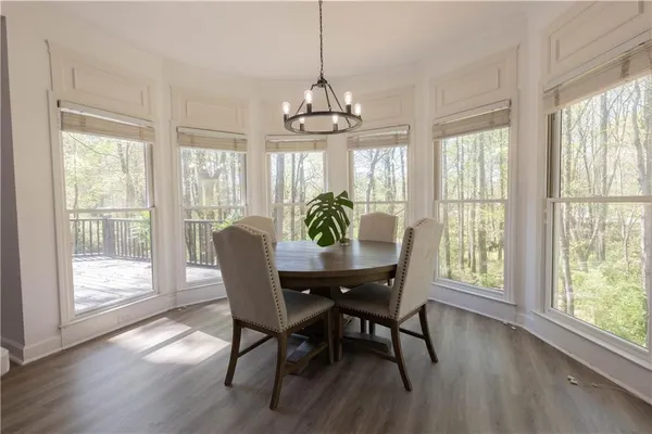 a dining room with furniture window wooden floor