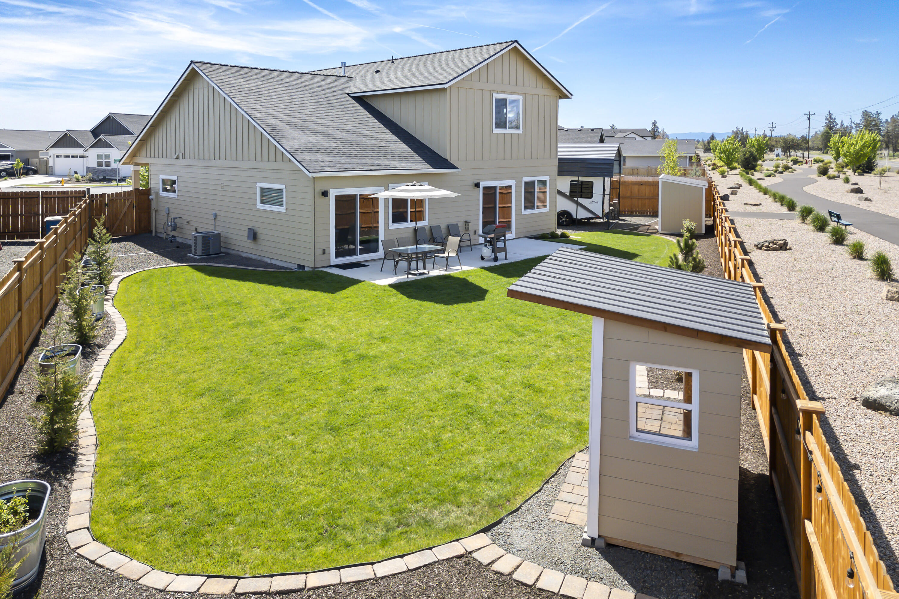 4999 Southwest Yew Place Redmond, OR 97756 - Photo 38 of 50 a aerial view of a house with swimming pool garden and patio