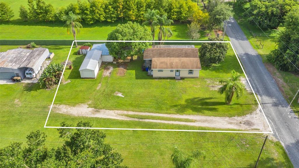 705 Rosedale Avenue St. Cloud, FL 34769 - Photo 1 of 1 Aerial of 2 homes on 1/2 acre.