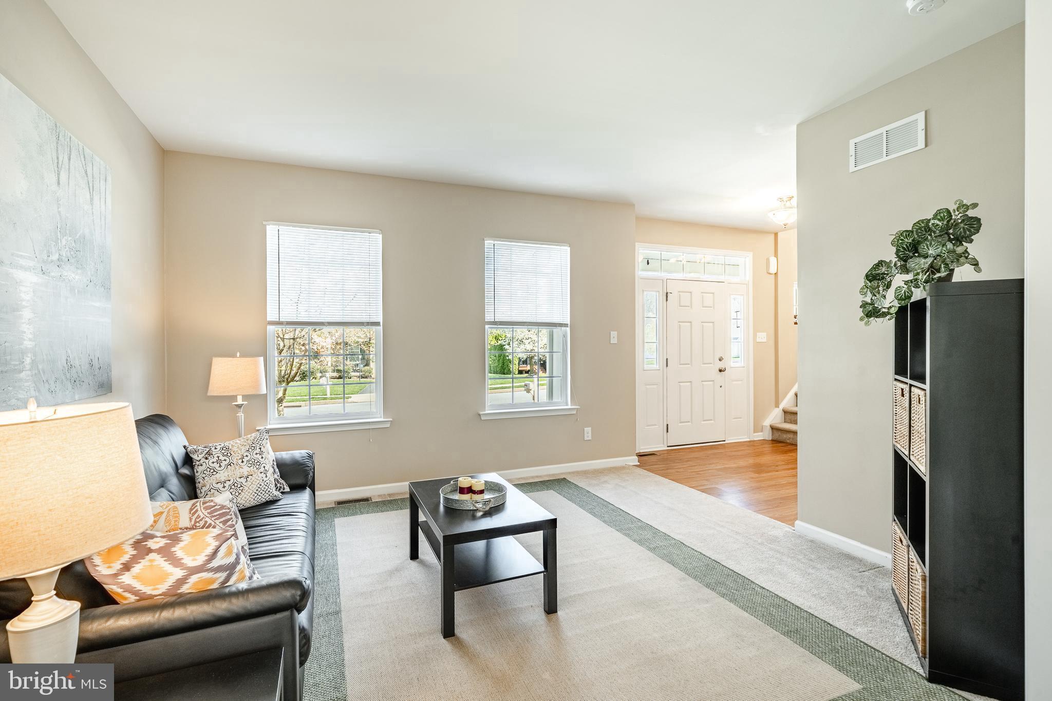 1345 Northumberland Road Coatesville, PA 19320 - Photo 14 of 52 a living room with furniture rug and a window