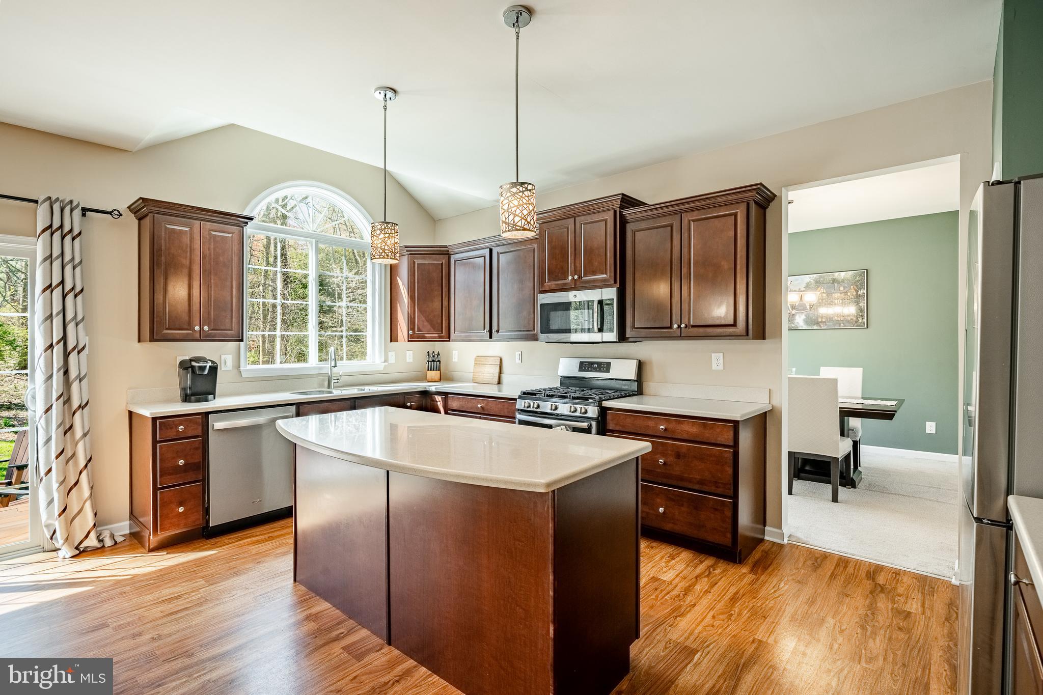 1345 Northumberland Road Coatesville, PA 19320 - Photo 19 of 52 a large kitchen with stainless steel appliances granite countertop a stove refrigerator and a sink