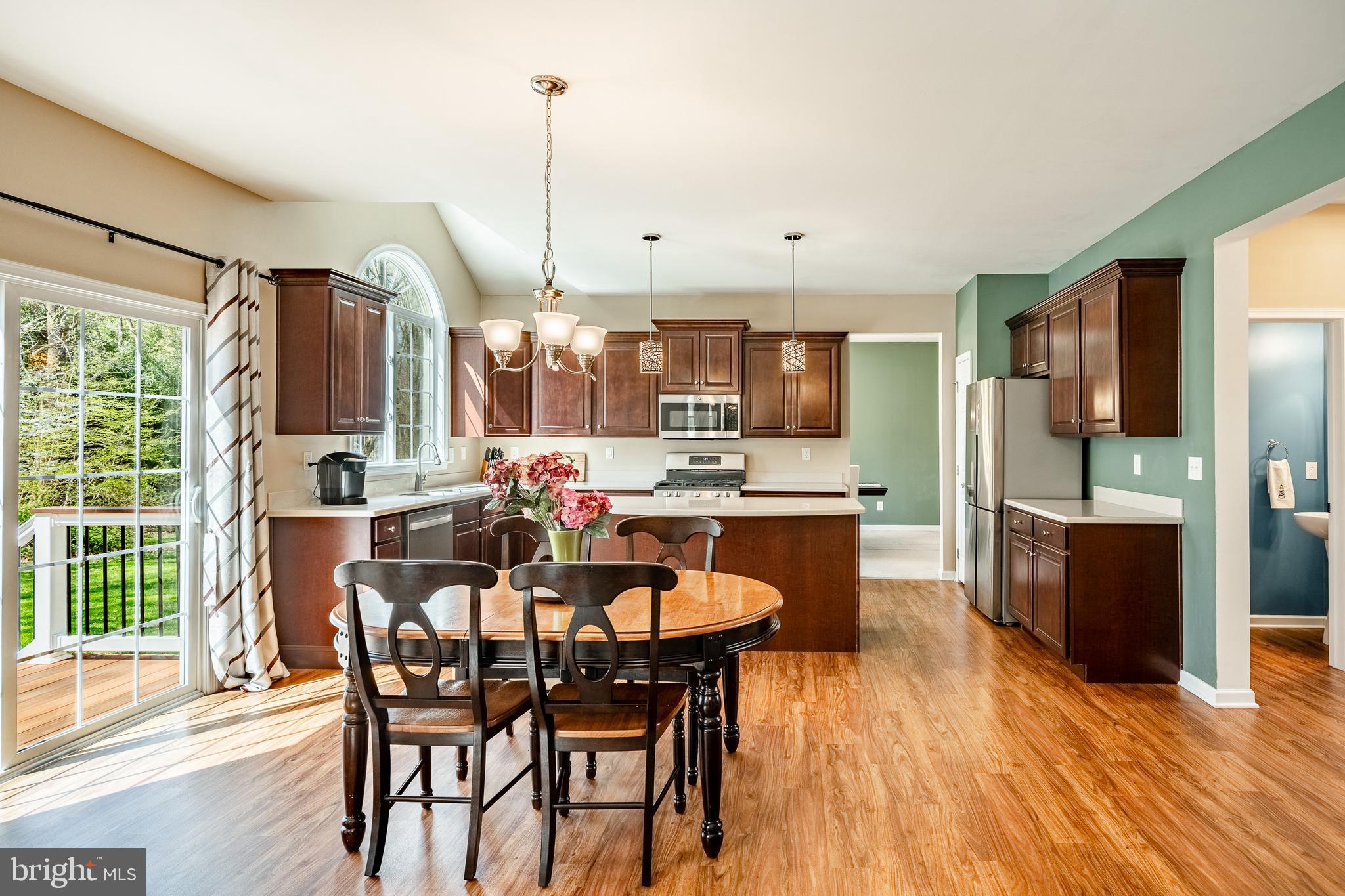 1345 Northumberland Road Coatesville, PA 19320 - Photo 21 of 52 a dining area with furniture a chandelier and wooden floor