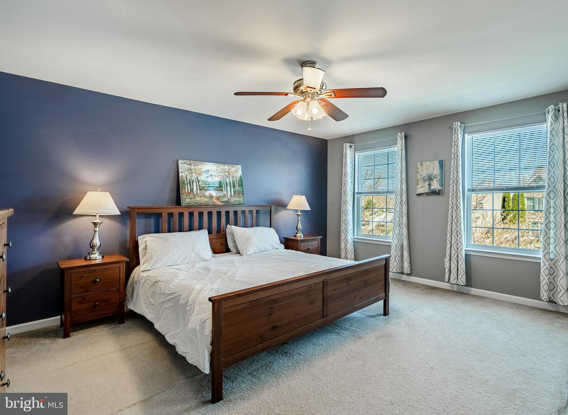 1345 Northumberland Road Coatesville, PA 19320 - Photo 27 of 52 a bedroom with a large bed and a chandelier