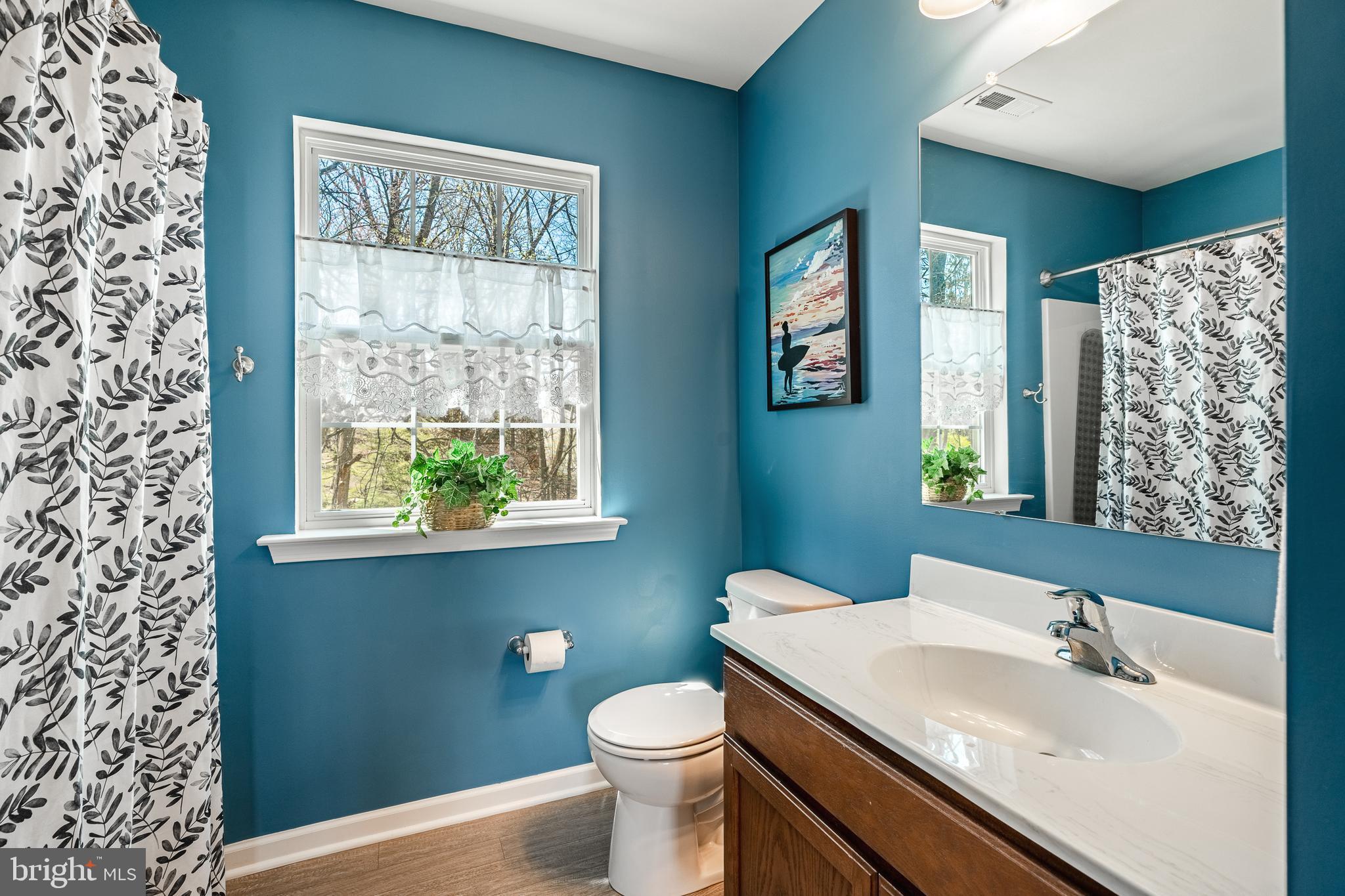 1345 Northumberland Road Coatesville, PA 19320 - Photo 34 of 52 a bathroom with a sink a toilet and shower