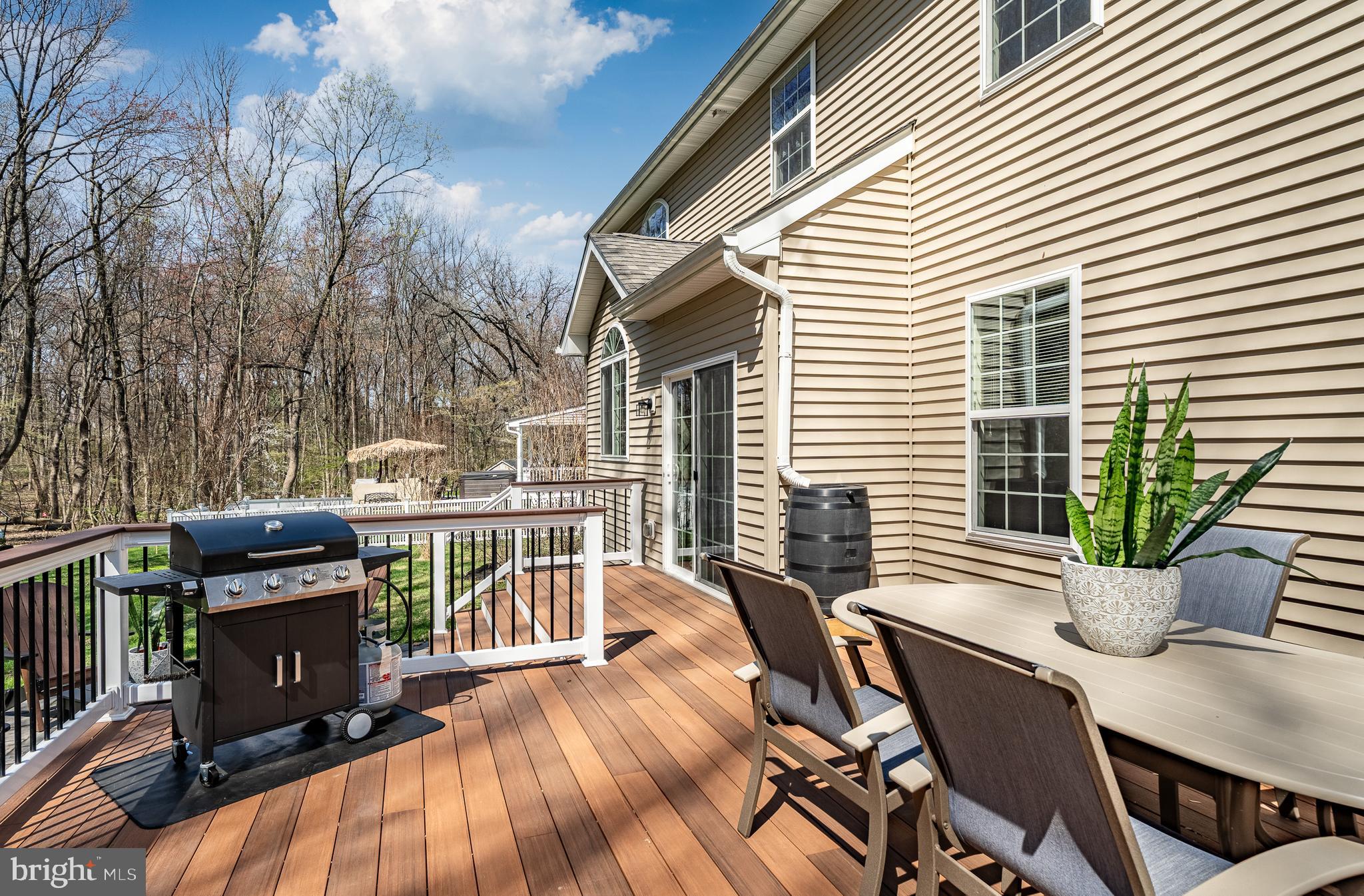 1345 Northumberland Road Coatesville, PA 19320 - Photo 6 of 52 a view of a patio with table and chairs and wooden floor