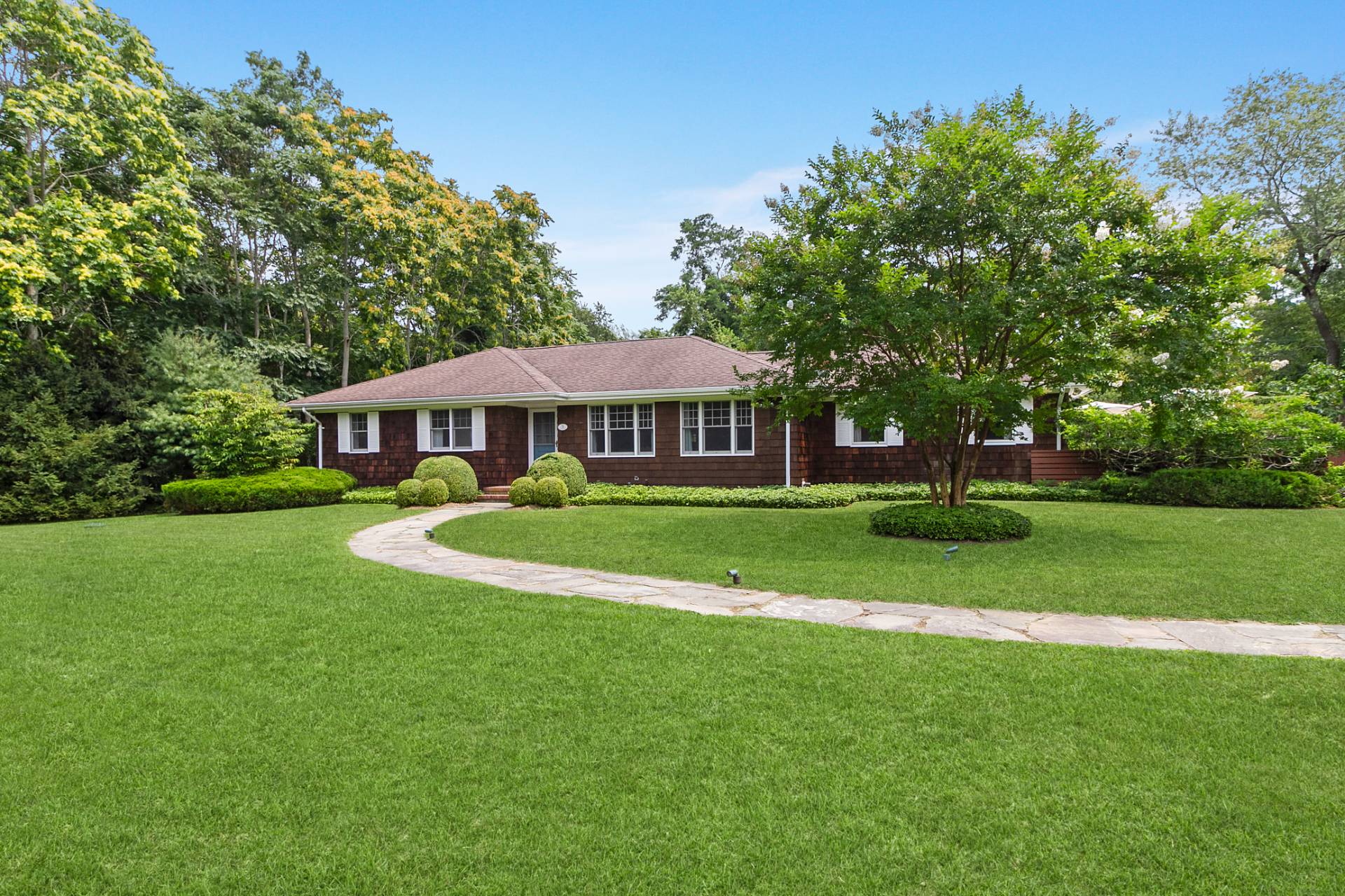 5 Coves End Lane Sag Harbor, NY 11963 - Photo 22 of 26 a front view of a house with a yard