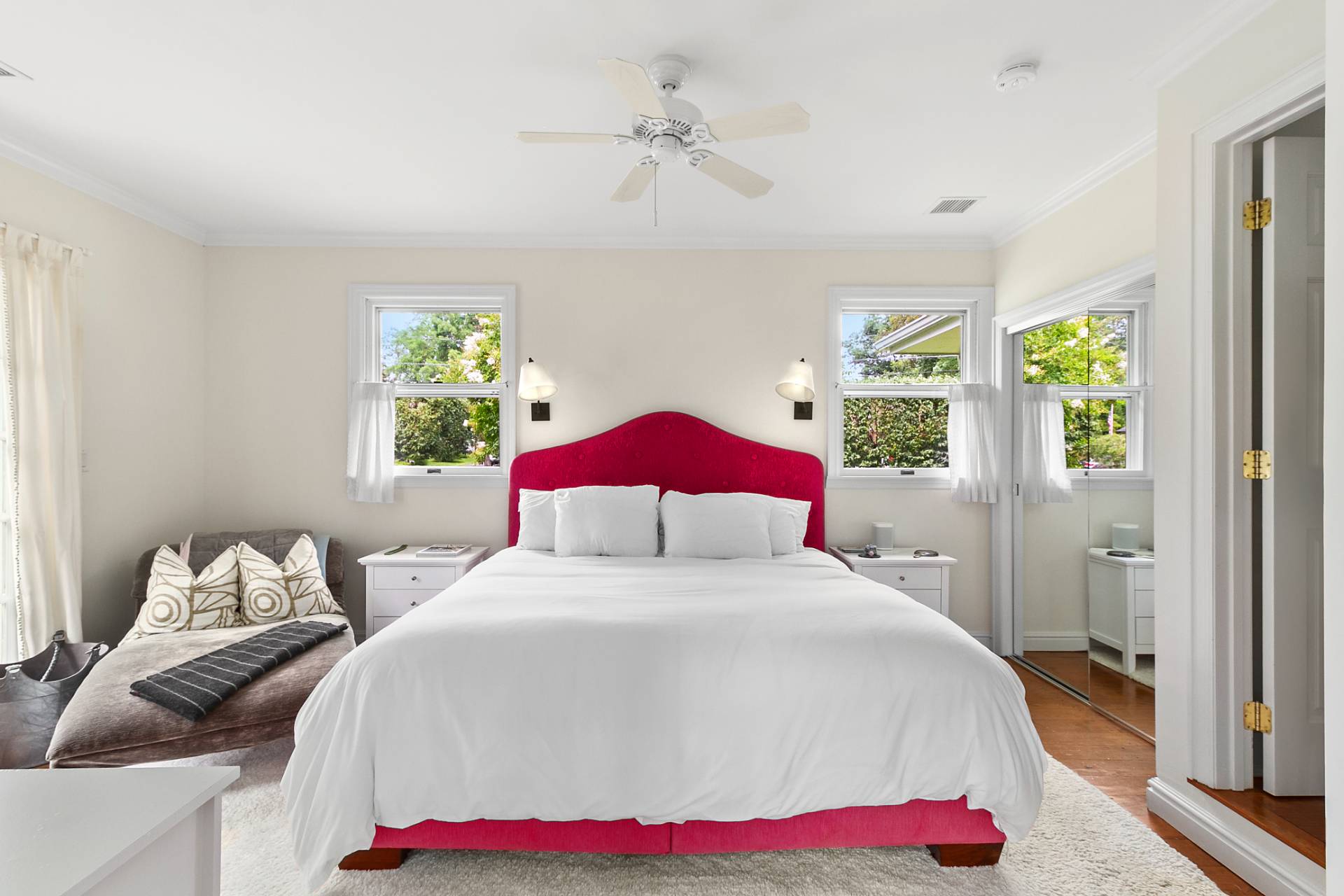 5 Coves End Lane Sag Harbor, NY 11963 - Photo 8 of 26 a bedroom with a bed and a chandelier