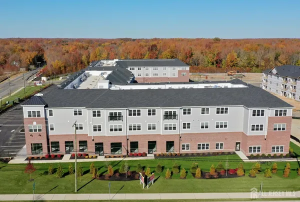 a view of a building with a yard