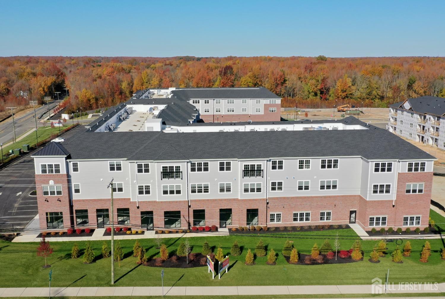 a view of a building with a yard