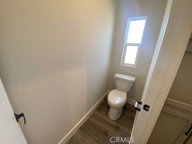 2920 Clark Road, Unit L6 Butte Valley, CA 95965 - Photo 23 of 26 a white toilet sitting in a bathroom next to a window