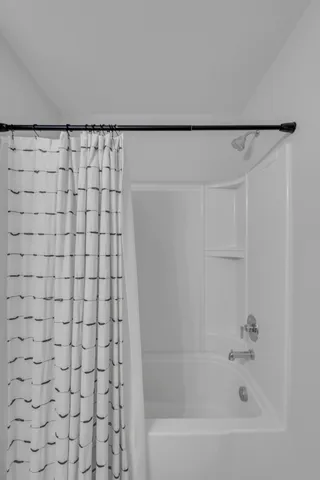 a view of house with backyard