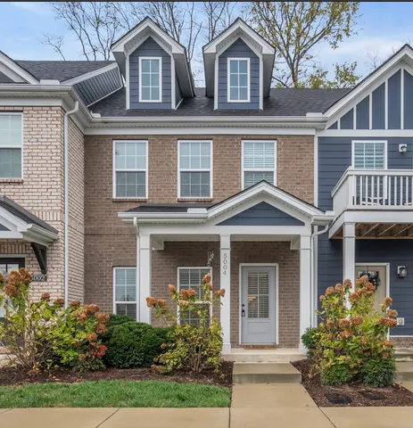 front view of building with a garden