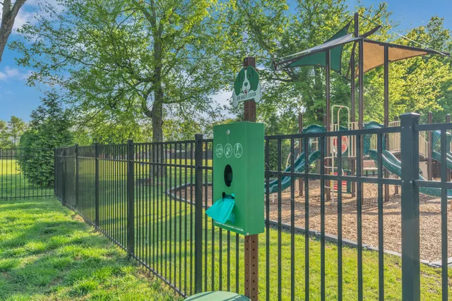 a view of a lake with houses in back