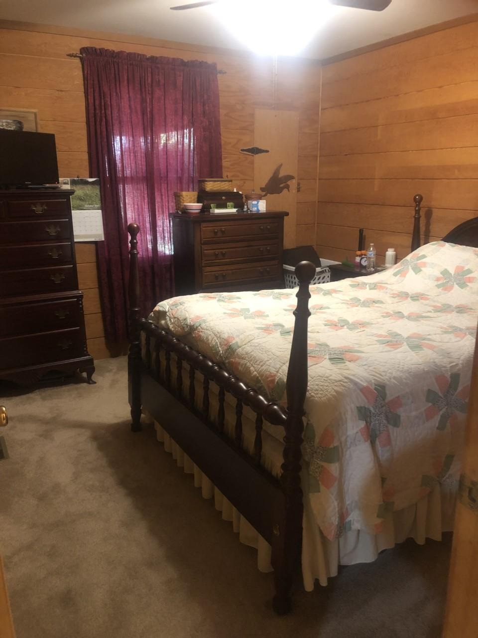 23359 German River Road Criders, VA 22820 - Photo 26 of 39 a bed sitting in a bedroom next to a bathroom