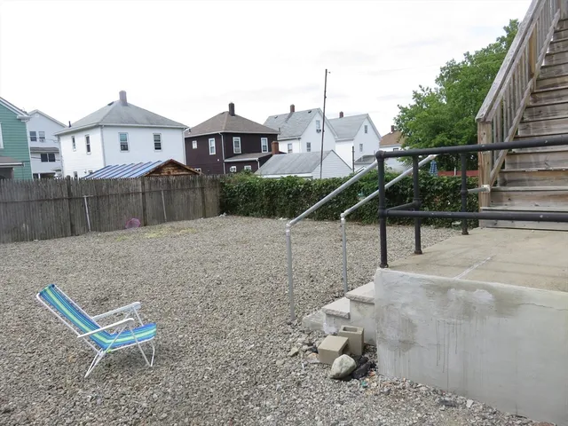 a kitchen with a sink cabinets and window