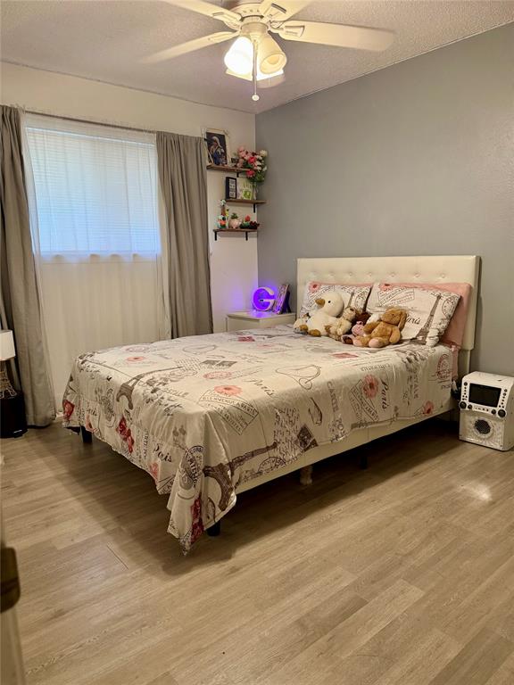 4420 Ocean Reef Mesquite, TX 75150 - Photo 5 of 9 a bedroom with a bed chandelier and a dresser