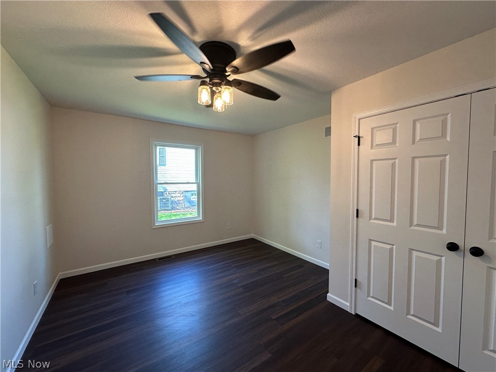 363 Sexton Street Struthers, OH 44471 - Photo 10 of 20 LTV flooring, a single window, and white paneled closet doors