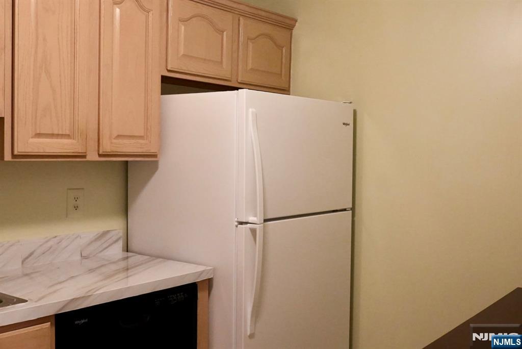 2009 Beatrice Court Mahwah, NJ 07430 - Photo 4 of 10 a white refrigerator freezer sitting in a kitchen