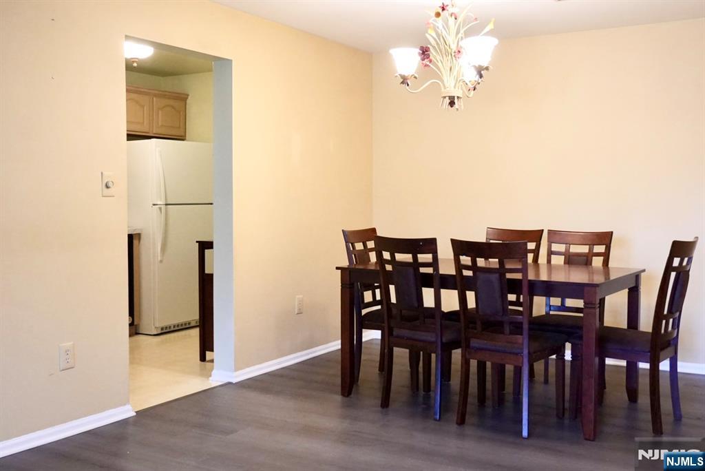 2009 Beatrice Court Mahwah, NJ 07430 - Photo 5 of 10 a view of a dining room with furniture and wooden floor