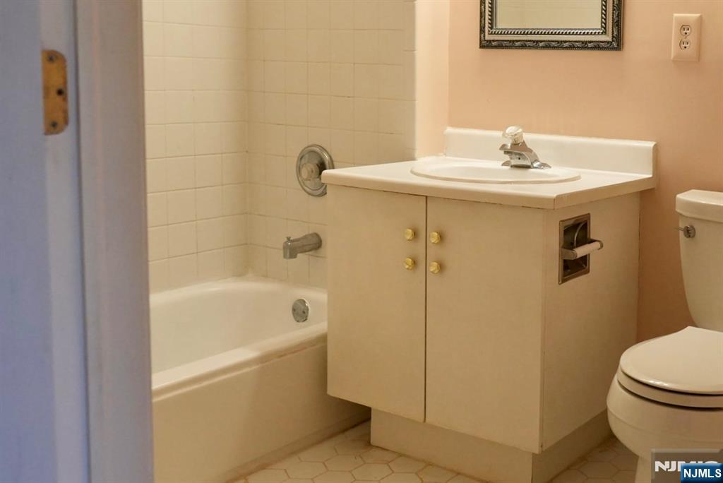 2009 Beatrice Court Mahwah, NJ 07430 - Photo 8 of 10 a bathroom with a sink a toilet and shower