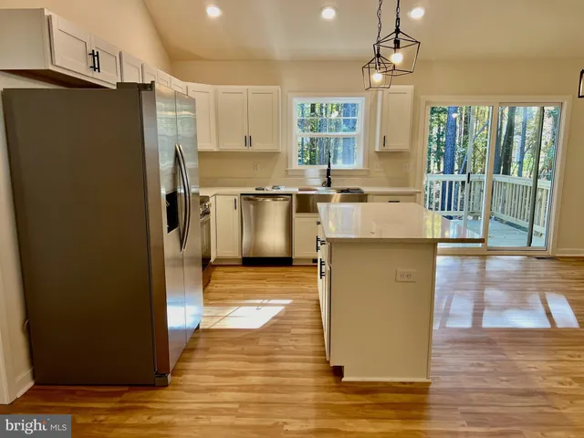 a kitchen with counter top space and refrigerator