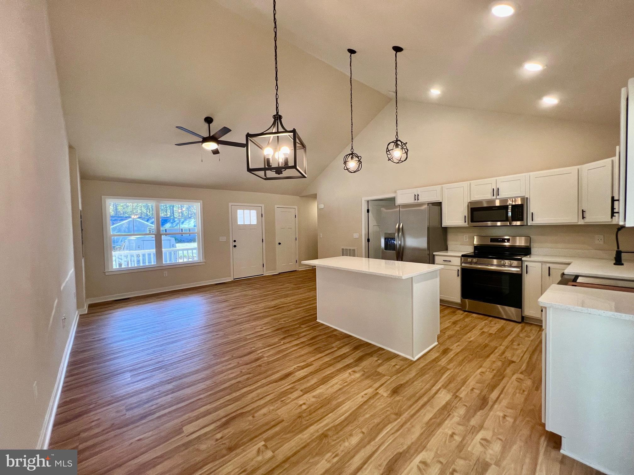 102 Azalea Way Colonial Beach, VA 22443 - Photo 7 of 10 a kitchen with stove and cabinets