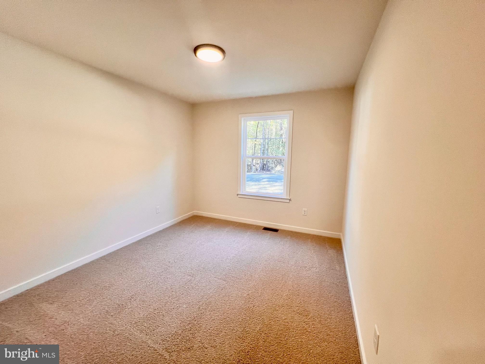 102 Azalea Way Colonial Beach, VA 22443 - Photo 8 of 10 an empty room with windows