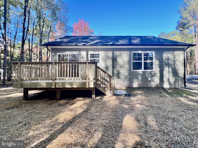 102 Azalea Way Colonial Beach, VA 22443 - Photo 10 of 10 a view of a house with a wooden deck and a yard