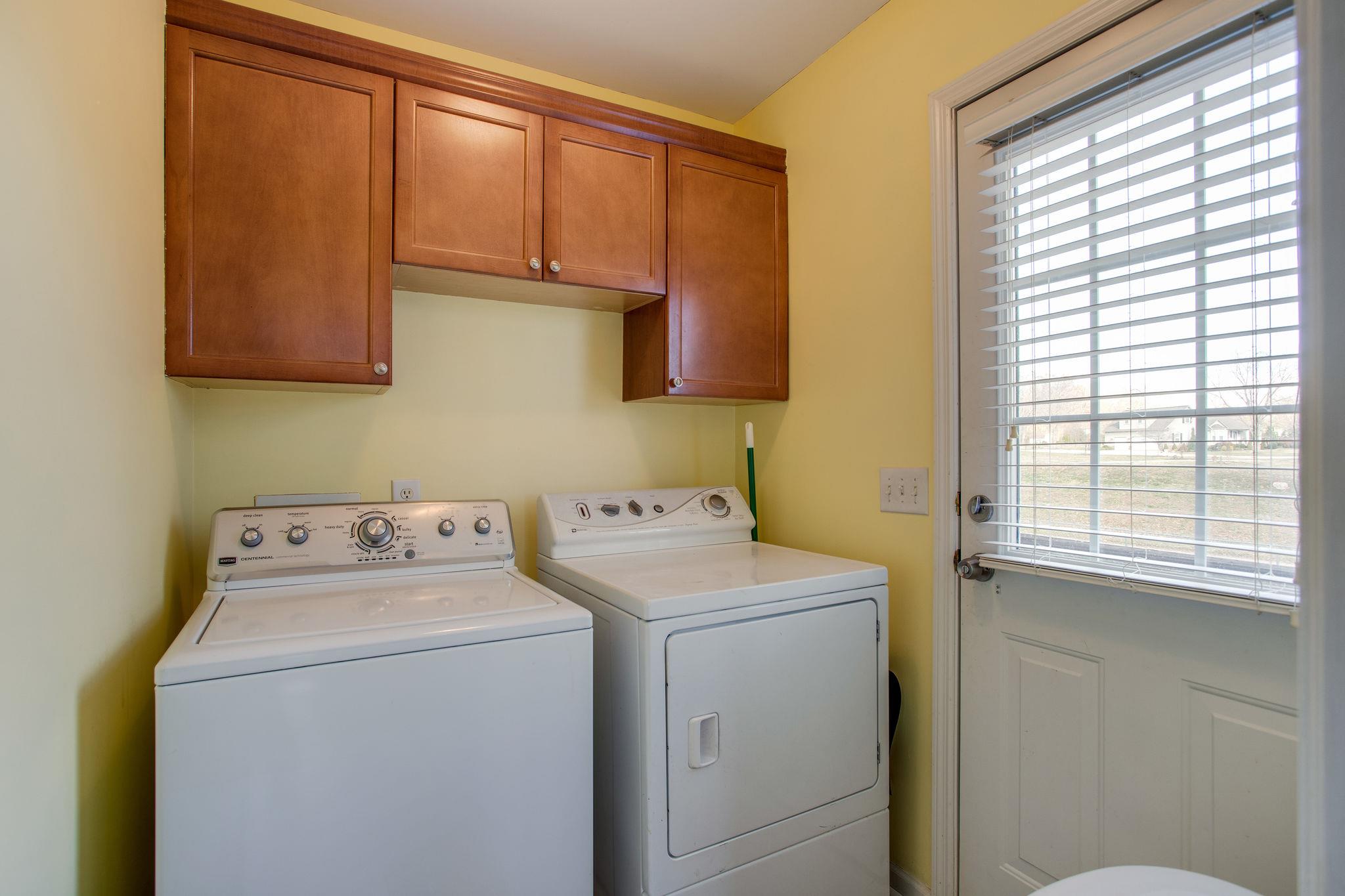 1967 Lasea Road Spring Hill, TN 37174 - Photo 12 of 30 a utility room with dryer and washer