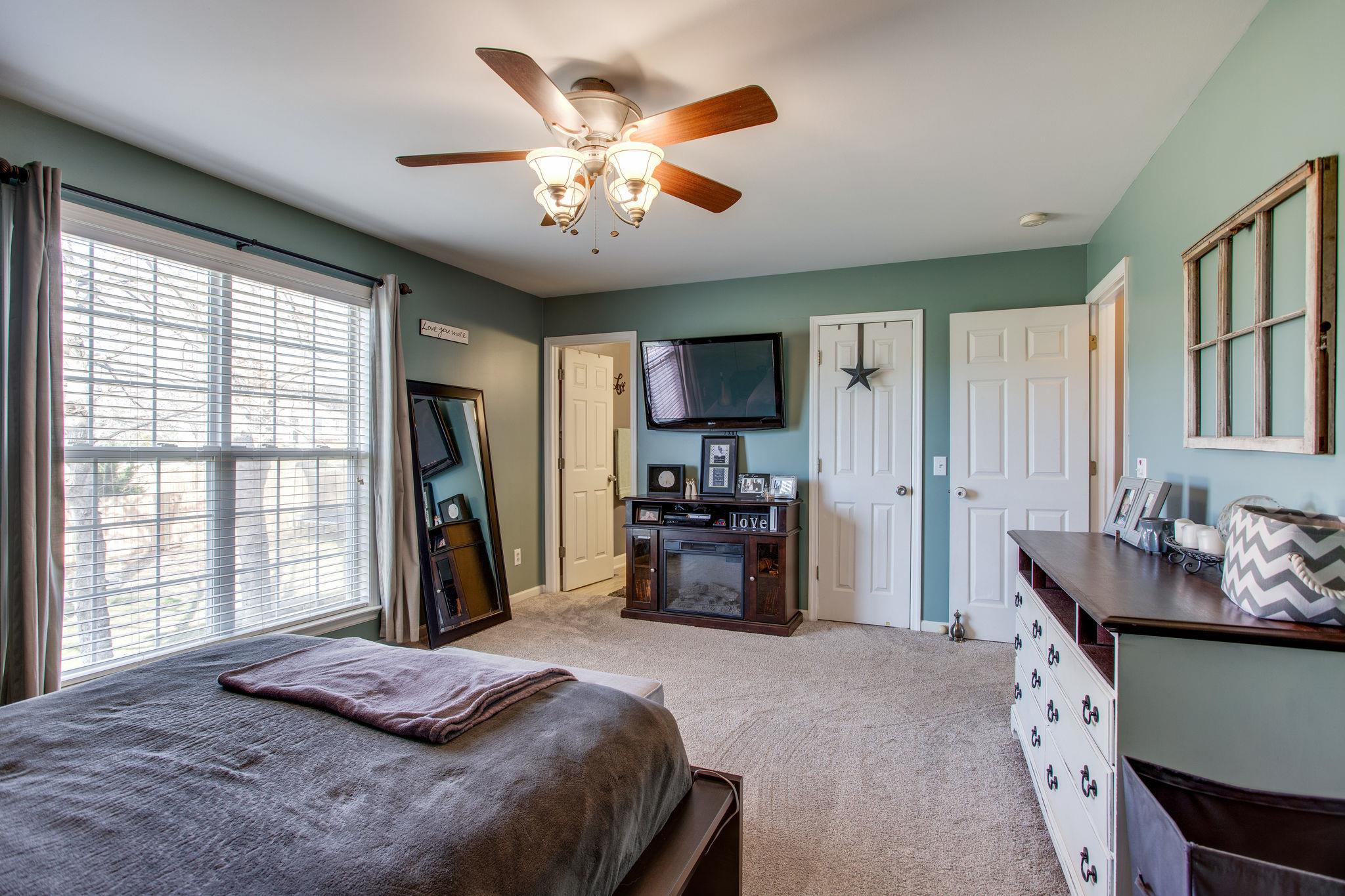 1967 Lasea Road Spring Hill, TN 37174 - Photo 14 of 30 a bedroom with a bed and a large window
