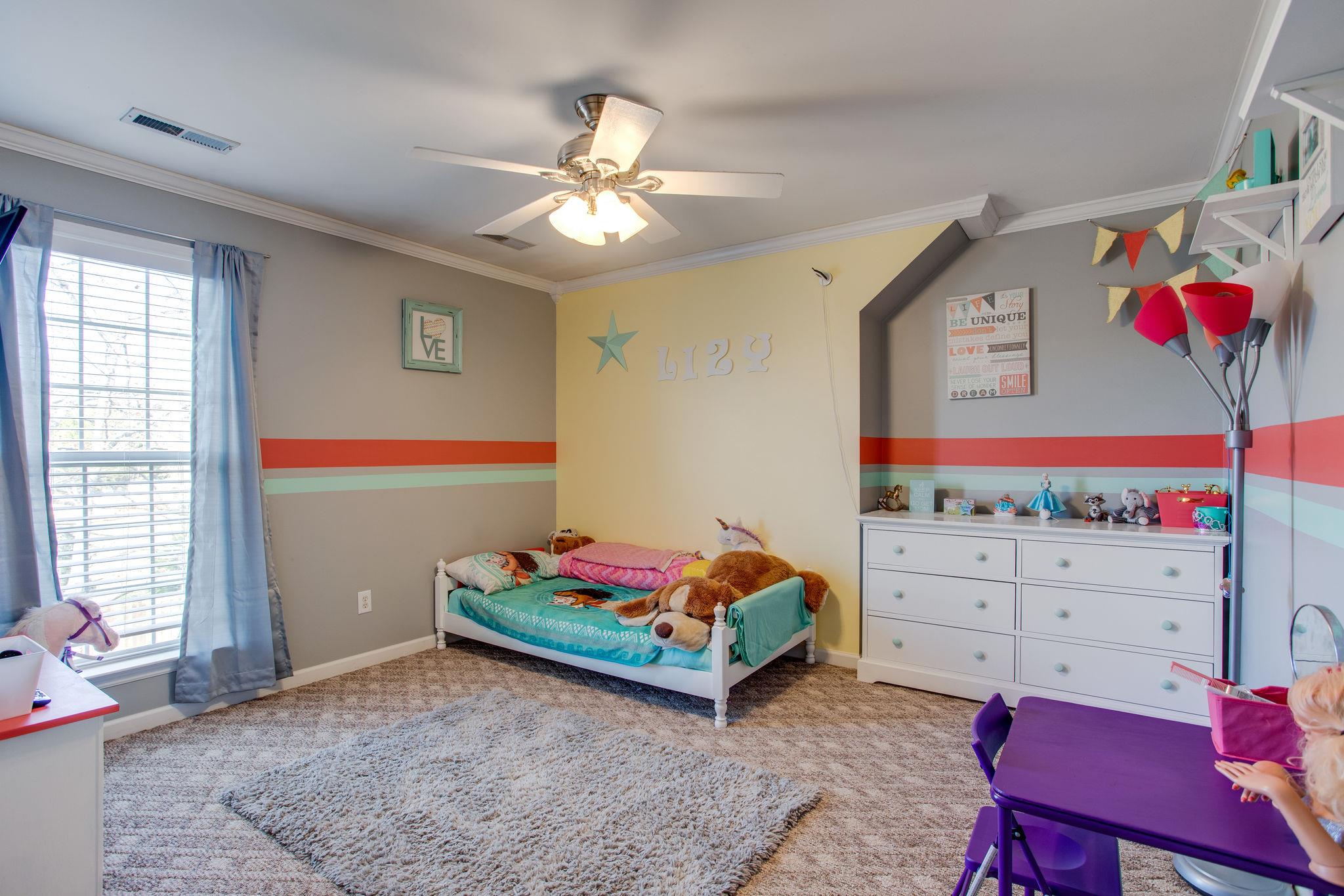 1967 Lasea Road Spring Hill, TN 37174 - Photo 18 of 30 a bed room with a bed and a window