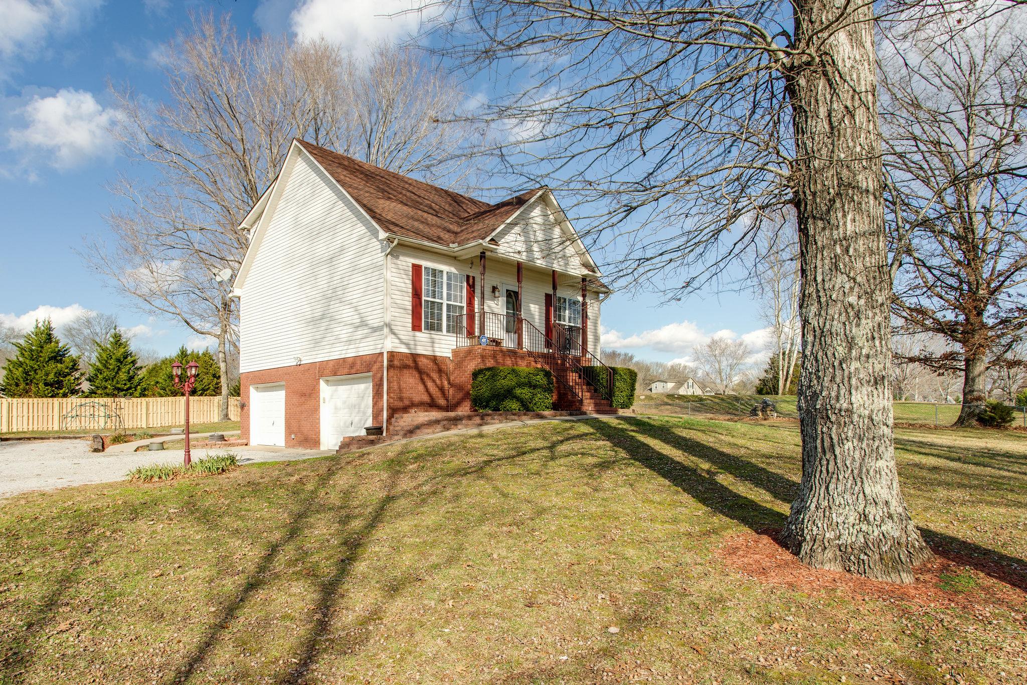 1967 Lasea Road Spring Hill, TN 37174 - Photo 26 of 30 a view of a house with a yard