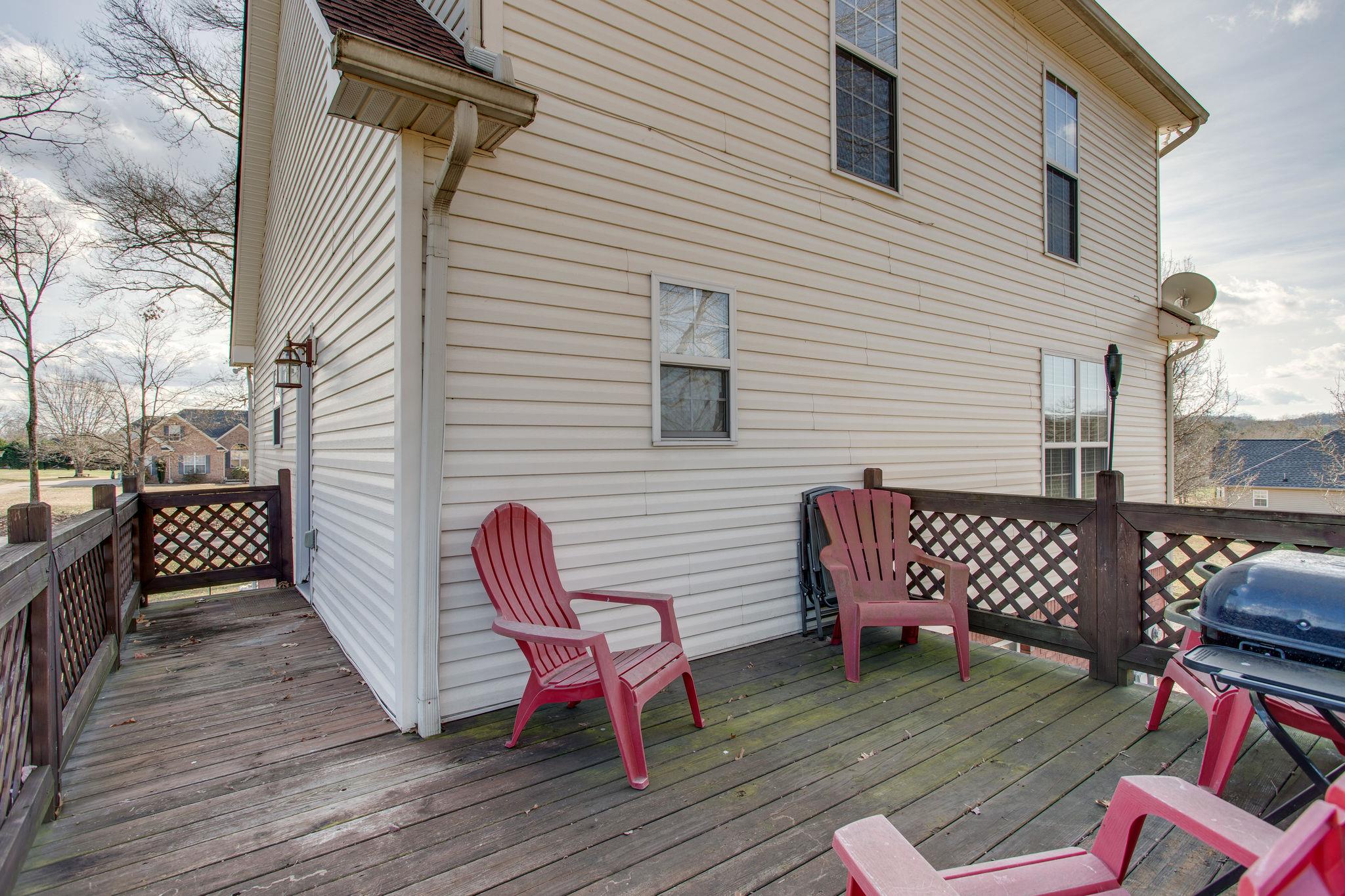 1967 Lasea Road Spring Hill, TN 37174 - Photo 30 of 30 a view of a wooden chairs on the deck