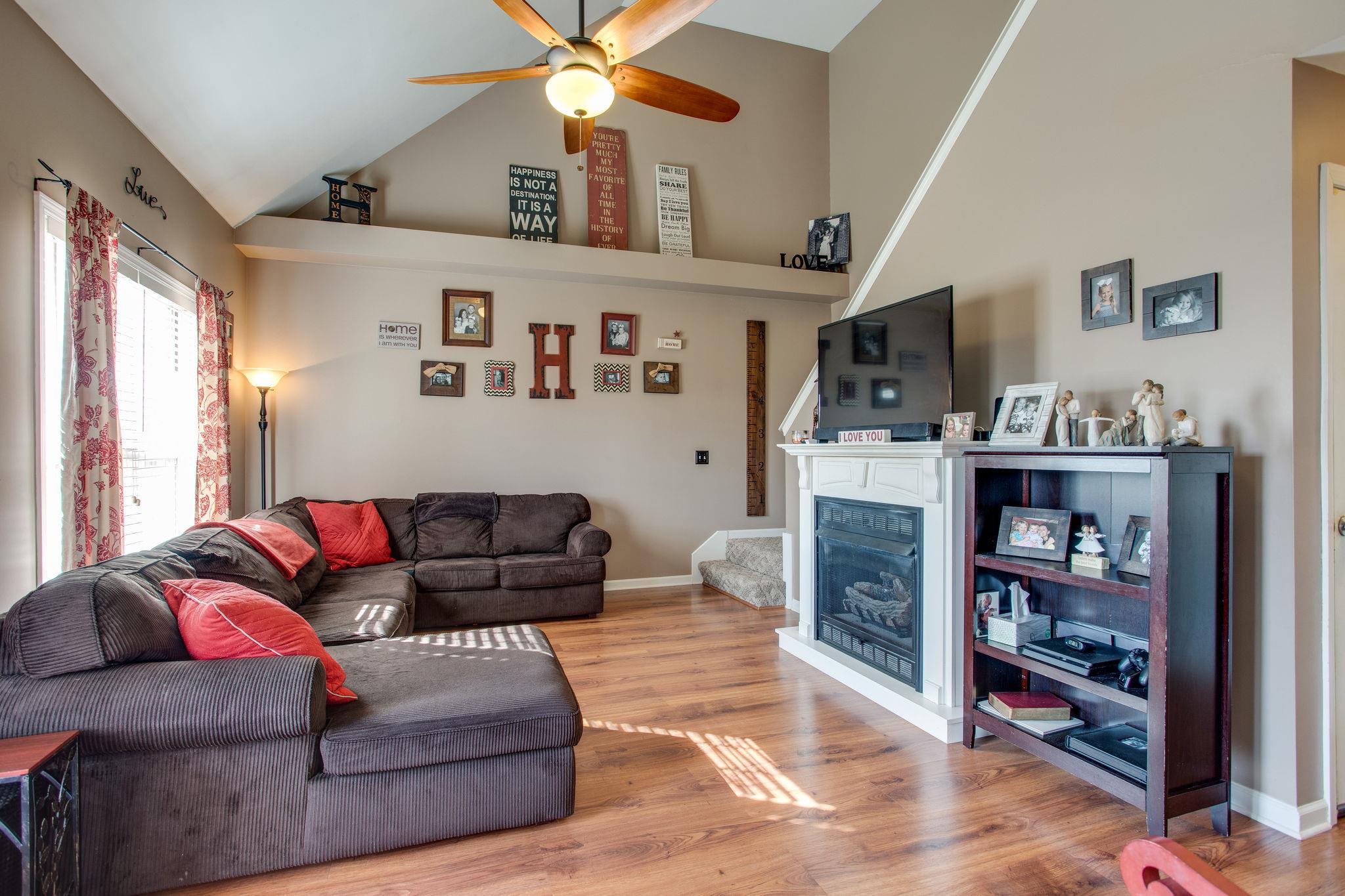 1967 Lasea Road Spring Hill, TN 37174 - Photo 4 of 30 a living room with furniture and a flat screen tv