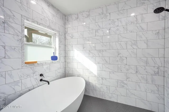 a bathroom with a bathtub