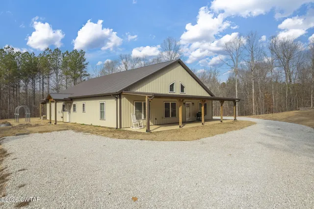 a view of a patio in a backyard