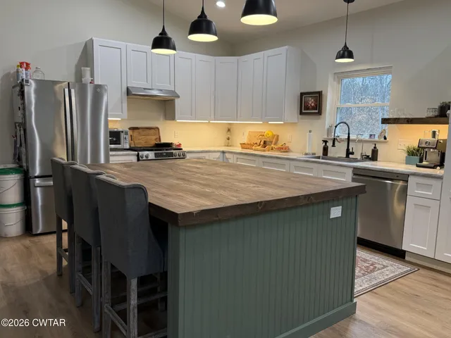a bedroom with a bed and a view of bathroom