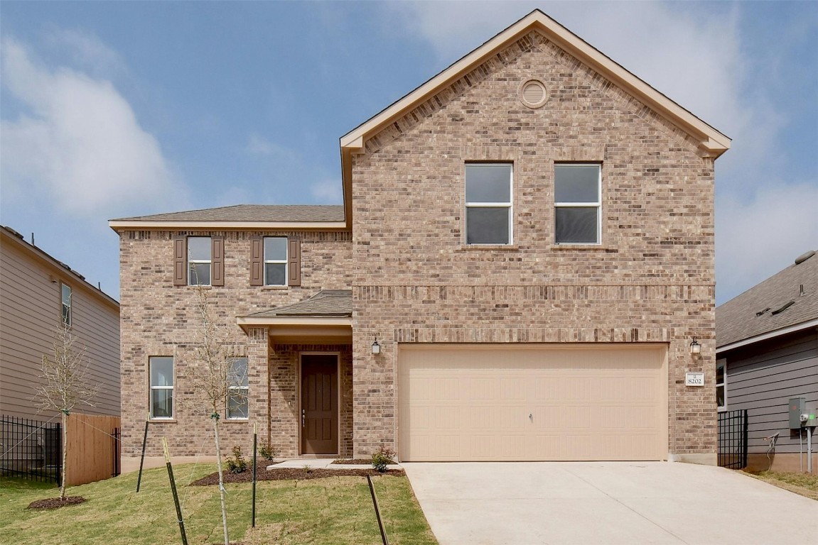 a front view of a house with yard