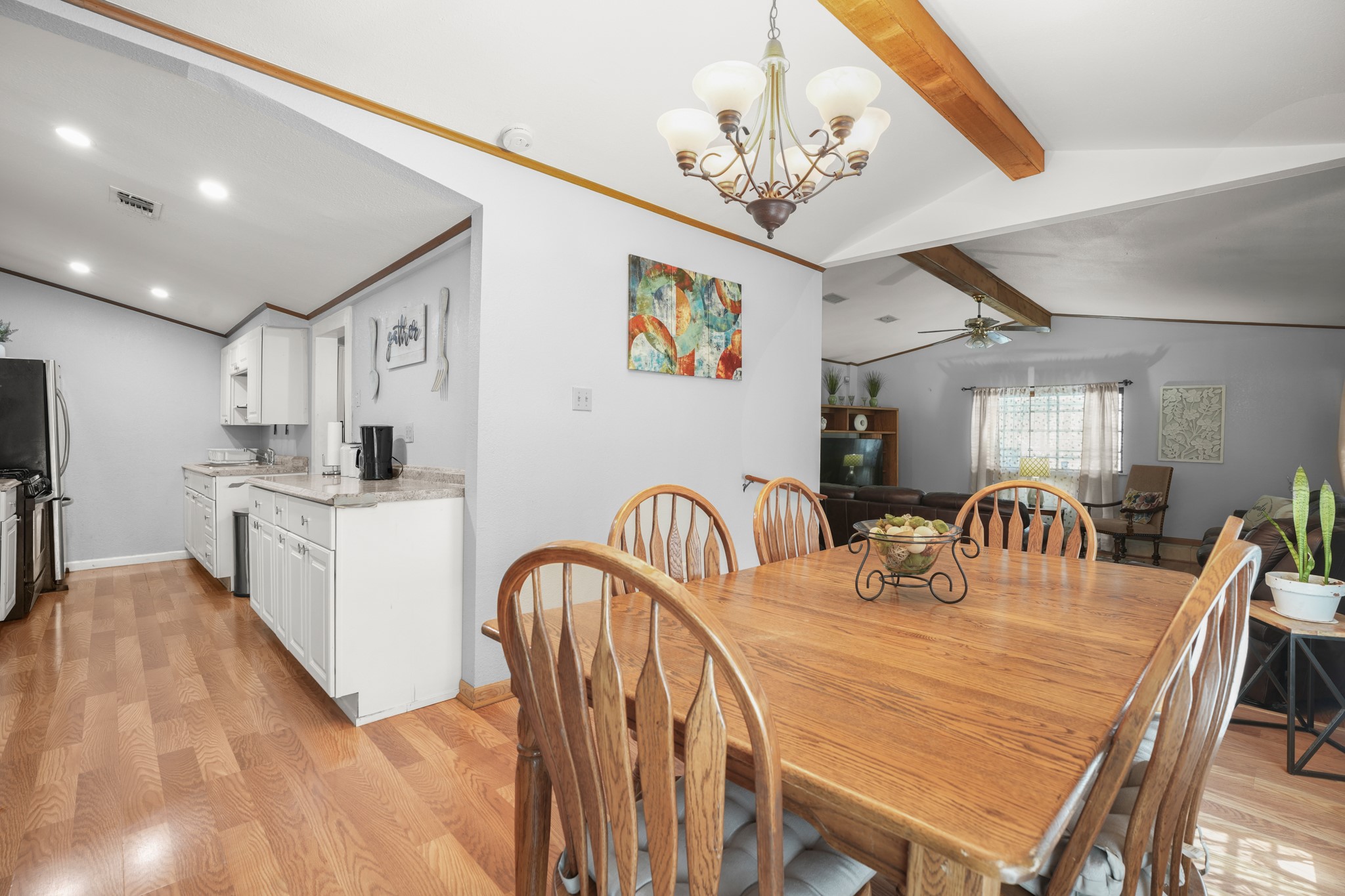 1908 Holly Street Austin, TX 78702 - Photo 5 of 22 An inviting open-concept area connects a functional kitchen with a cozy dining space, perfect for gatherings.