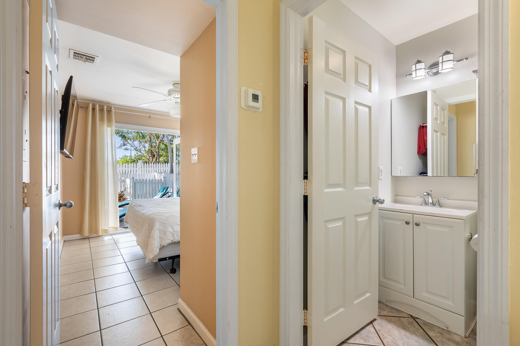 620 Thomas Street, Unit 175 Key West, FL 33040 - Photo 18 of 30 a bathroom with a sink and a mirror
