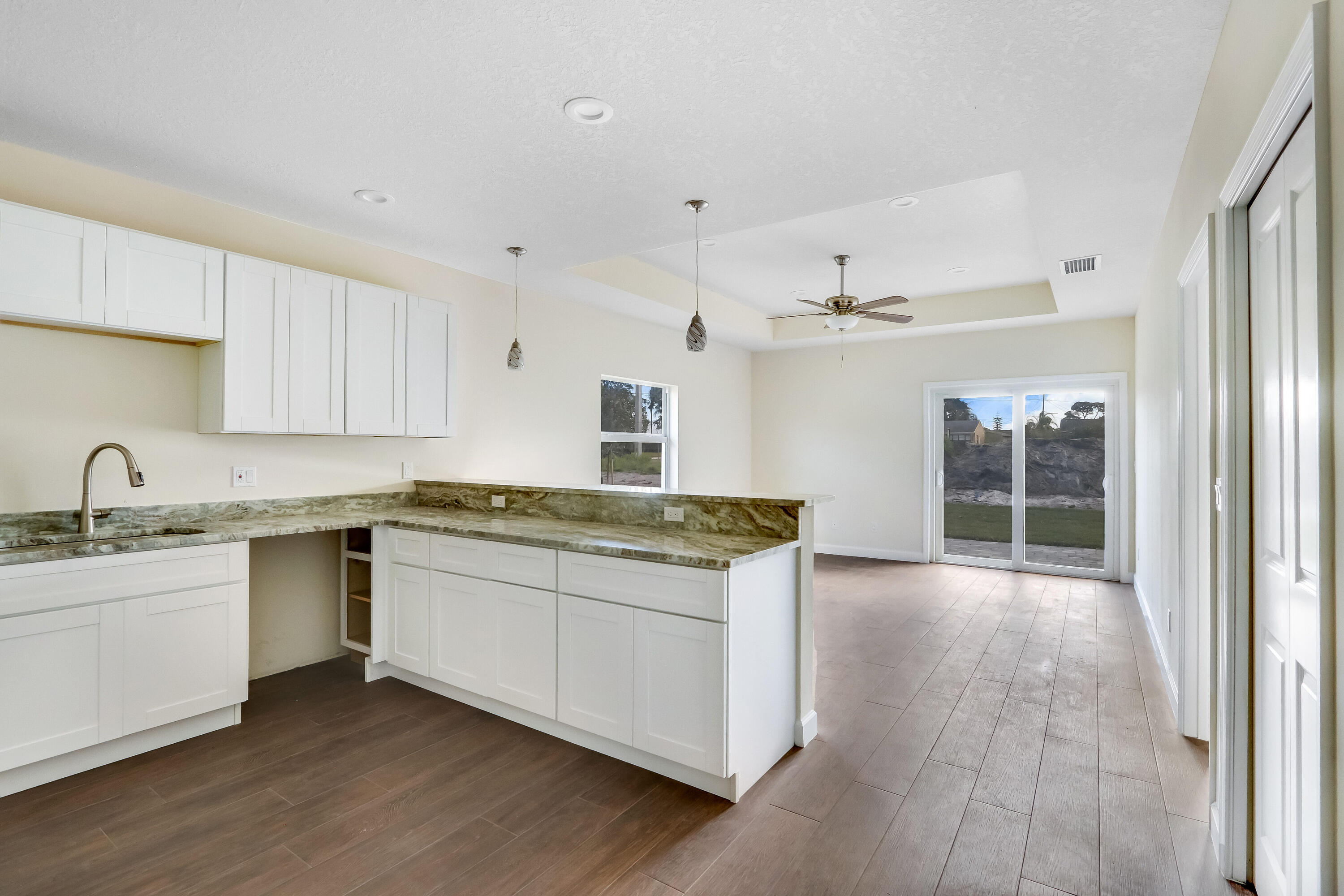 936 Southeast 6th Street Stuart, FL 34994 - Photo 11 of 25 a kitchen with stainless steel appliances granite countertop a sink and stove