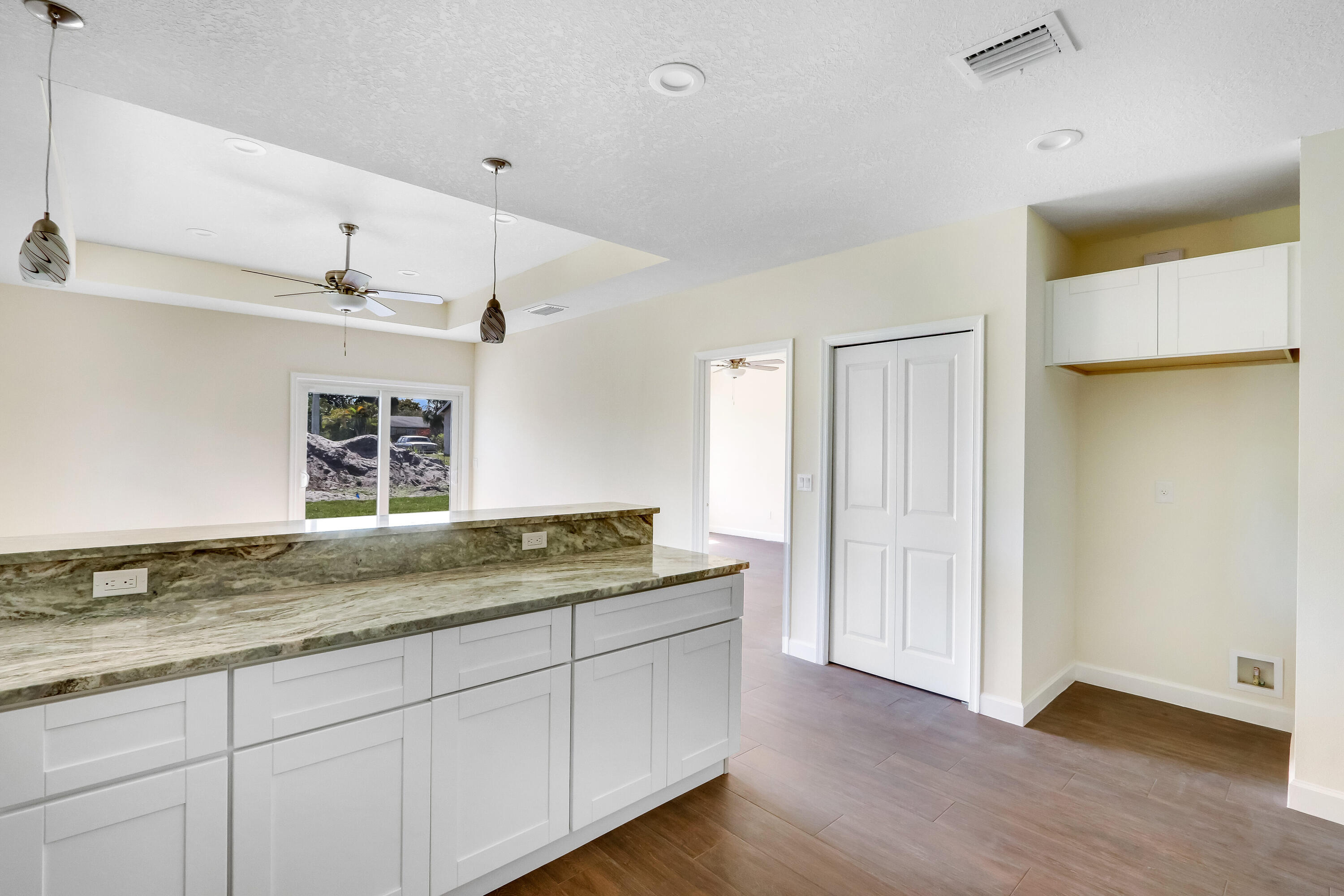 936 Southeast 6th Street Stuart, FL 34994 - Photo 12 of 25 a bathroom with a granite countertop sink and a mirror