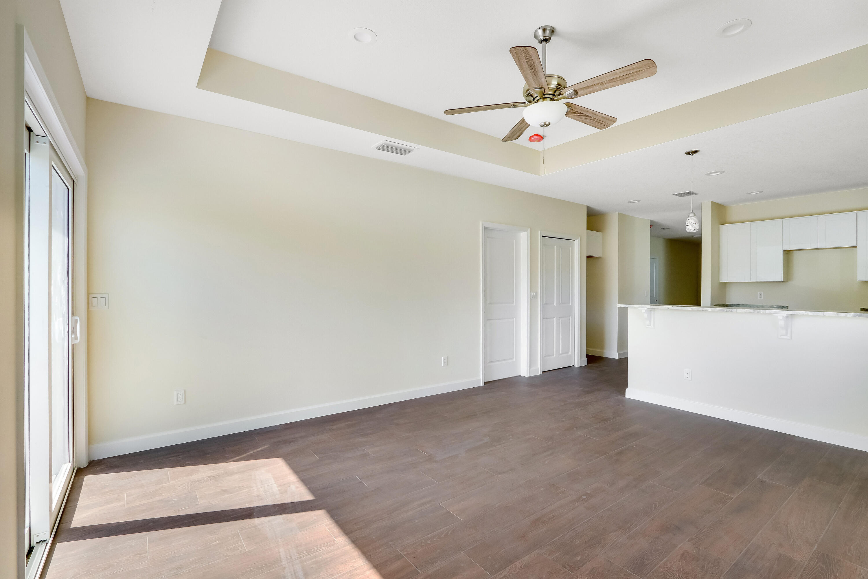 936 Southeast 6th Street Stuart, FL 34994 - Photo 16 of 25 a view of an empty room with a ceiling fan