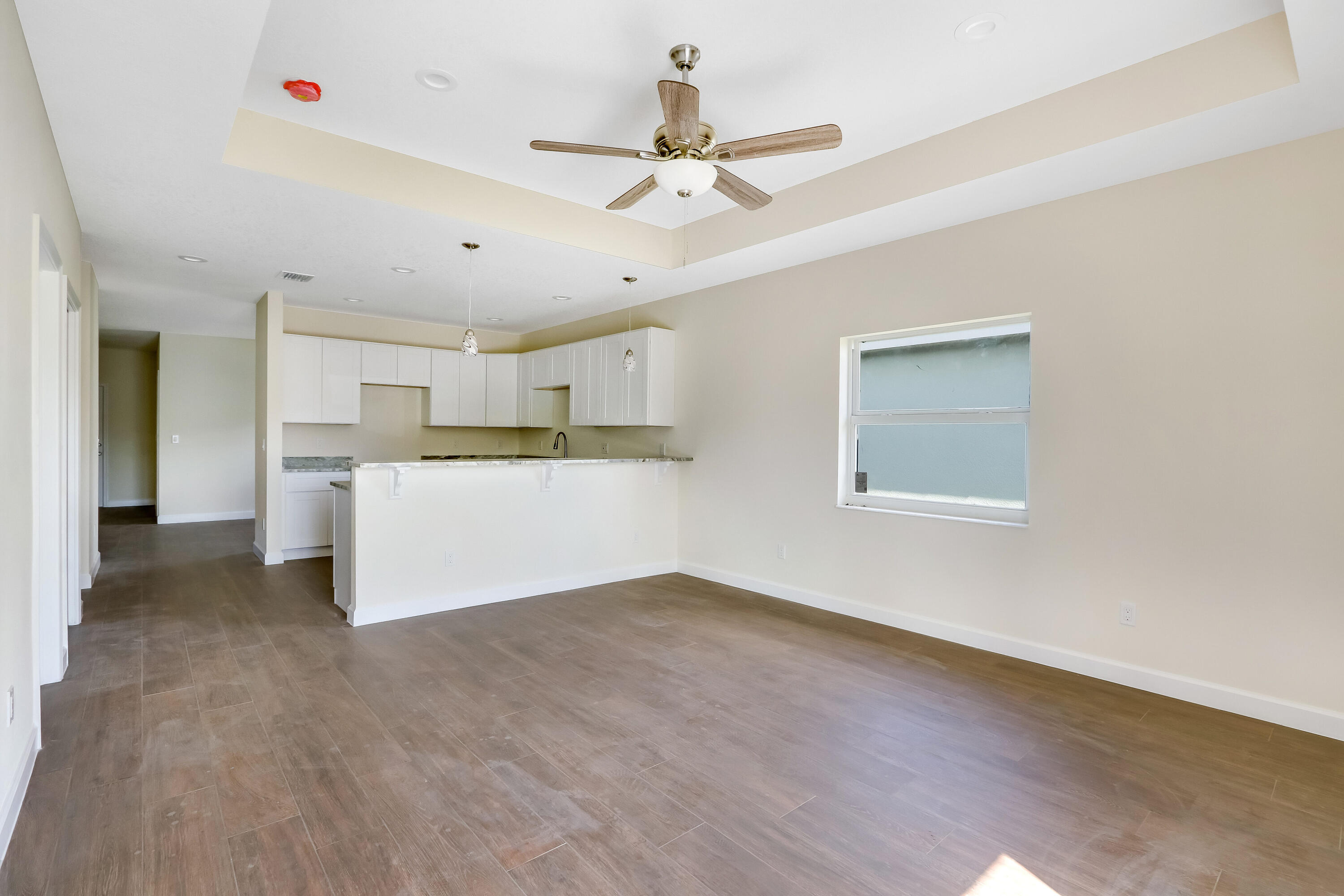 936 Southeast 6th Street Stuart, FL 34994 - Photo 17 of 25 a view of a kitchen with a sink cabinets and wooden floor