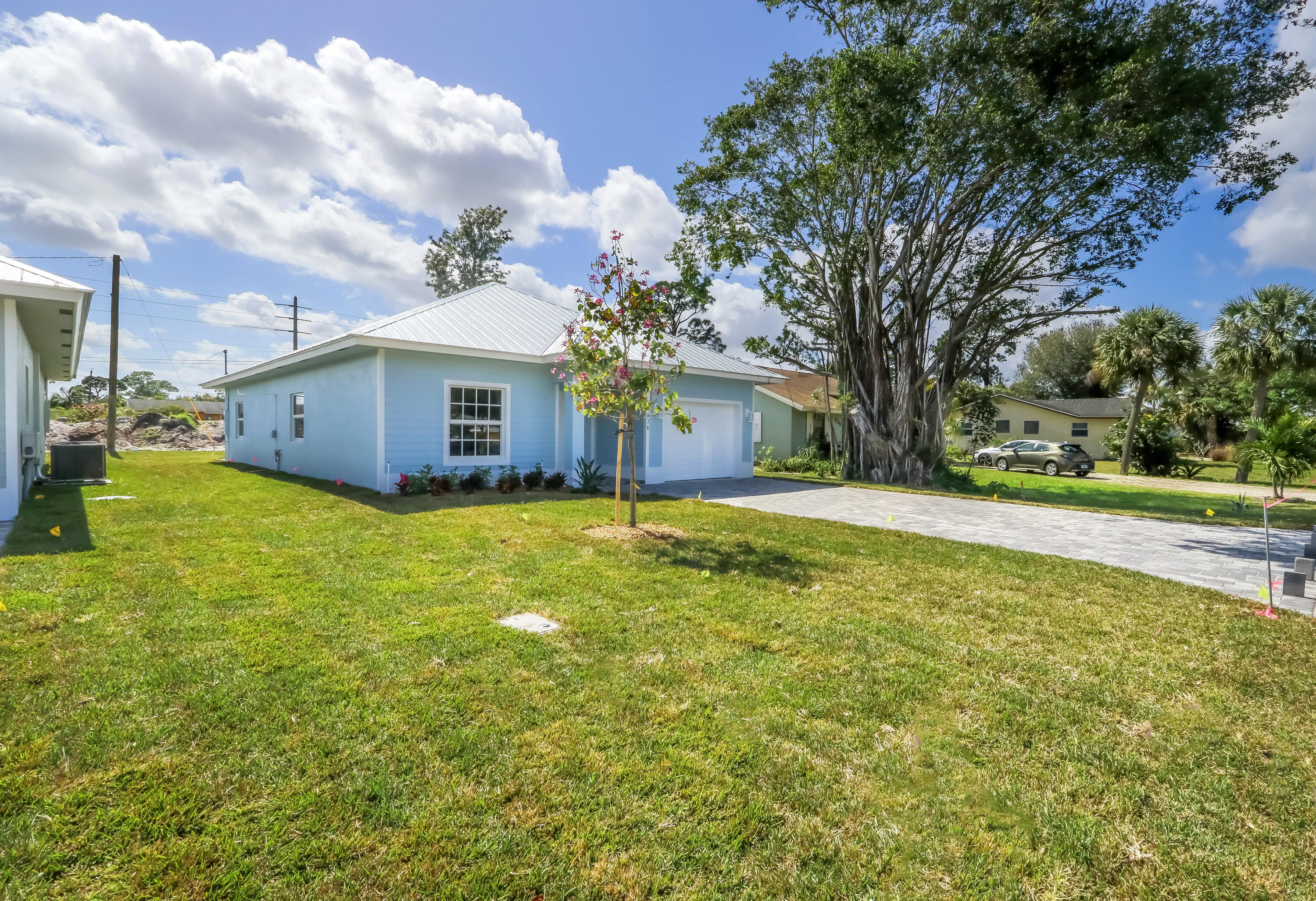 936 Southeast 6th Street Stuart, FL 34994 - Photo 2 of 25 a view of a house with a yard