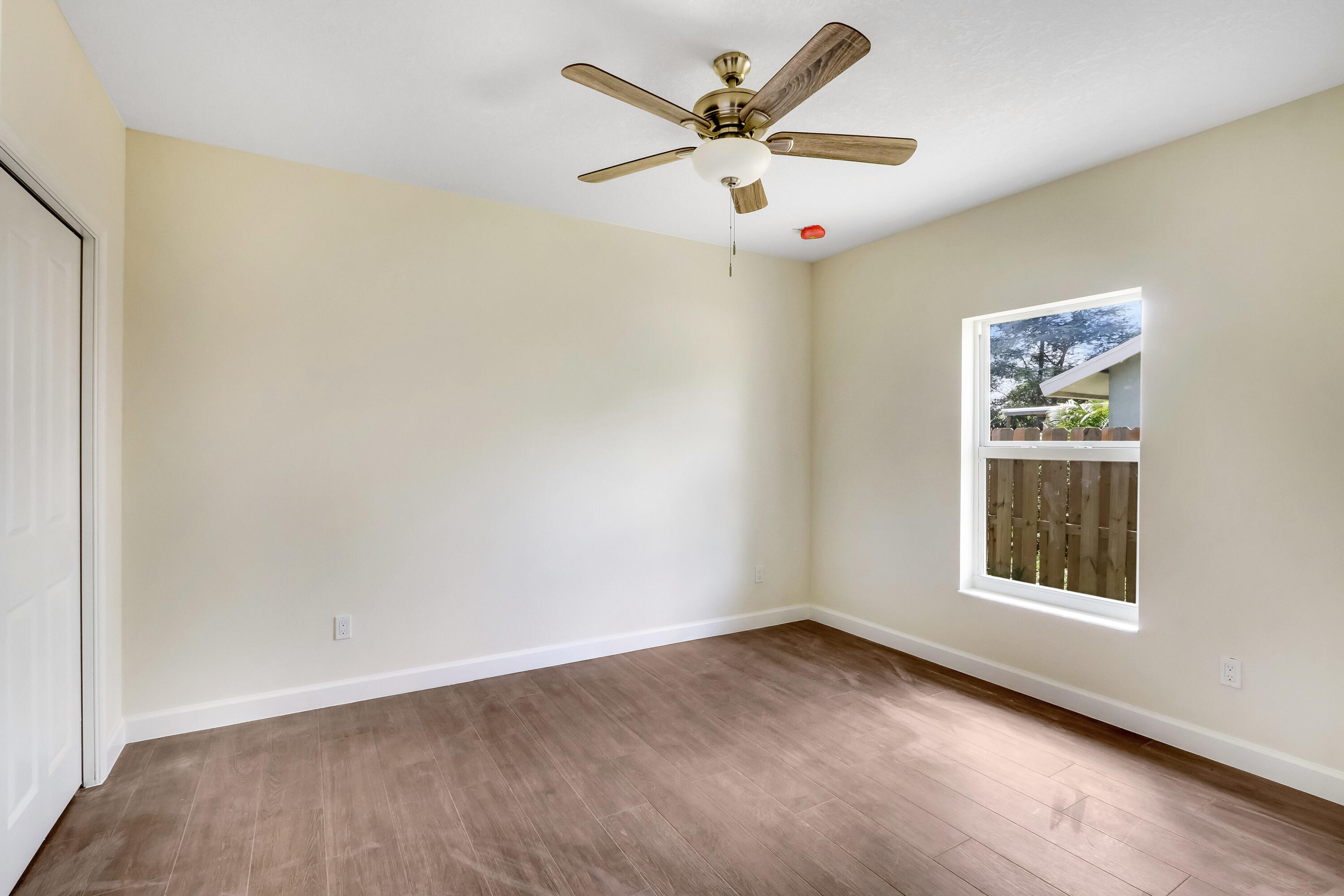 936 Southeast 6th Street Stuart, FL 34994 - Photo 22 of 25 an empty room with a window